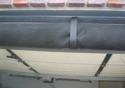 Overhead door screen rolled up